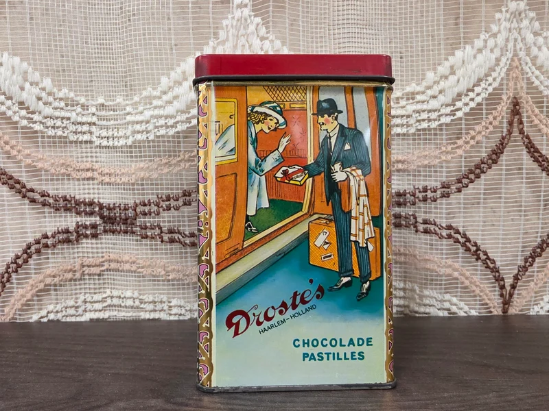 Vintage Droste cacao blik met vier verschillende afbeeldingen