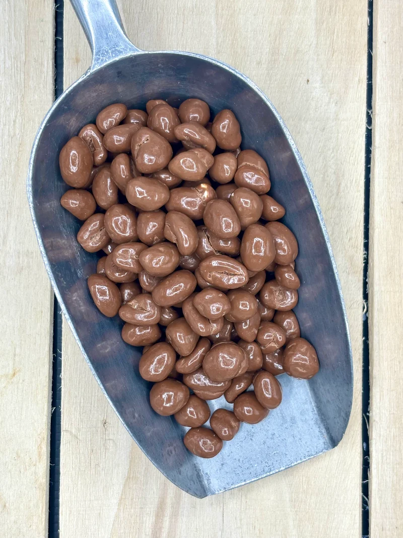 Cacahuètes enrobées de chocolat au lait +/- 150gr