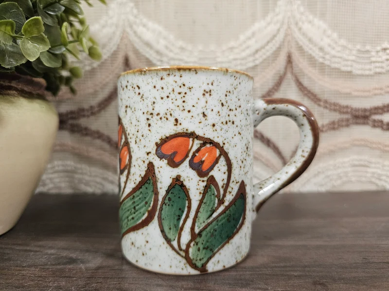 Vintage mok gespikkeld oranje bloemmotief 9,5 cm