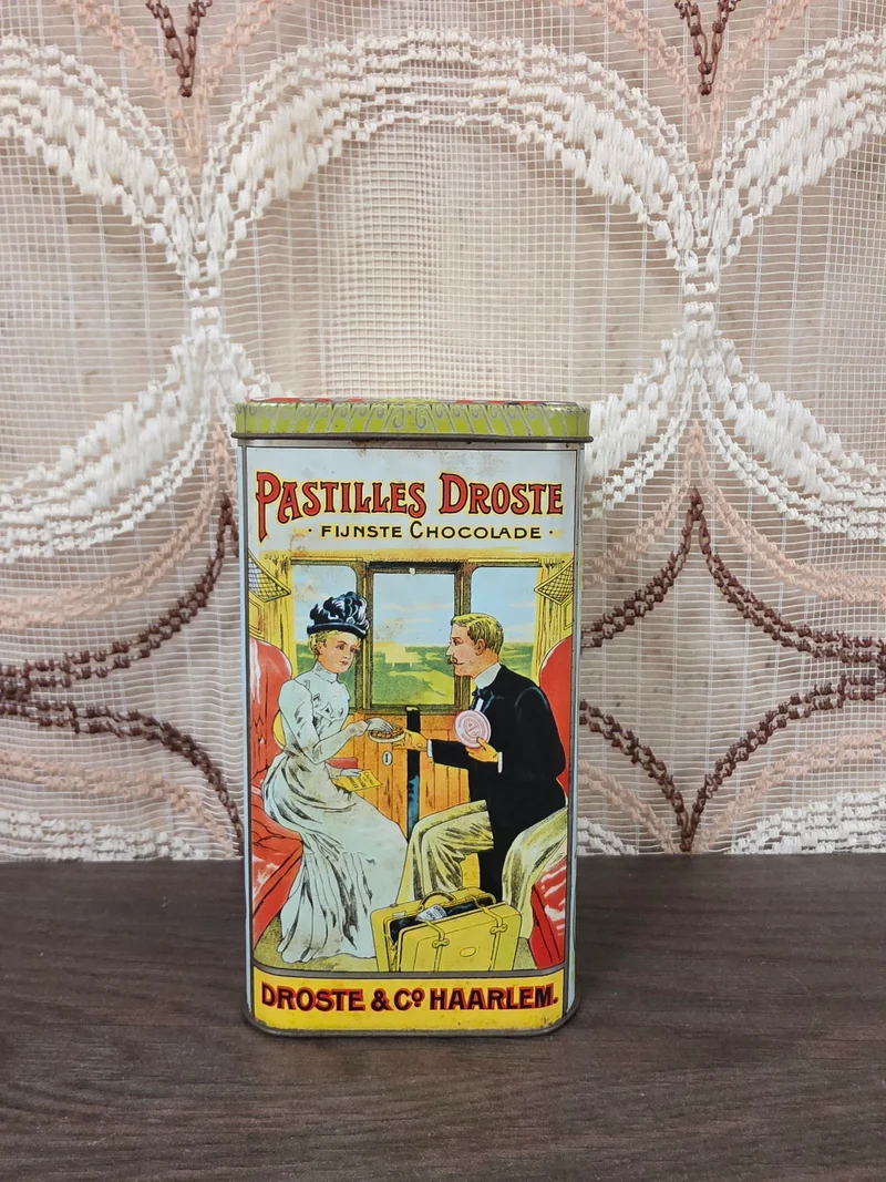 Vintage Droste cacao blik met klassieke reclameafbeeldingen